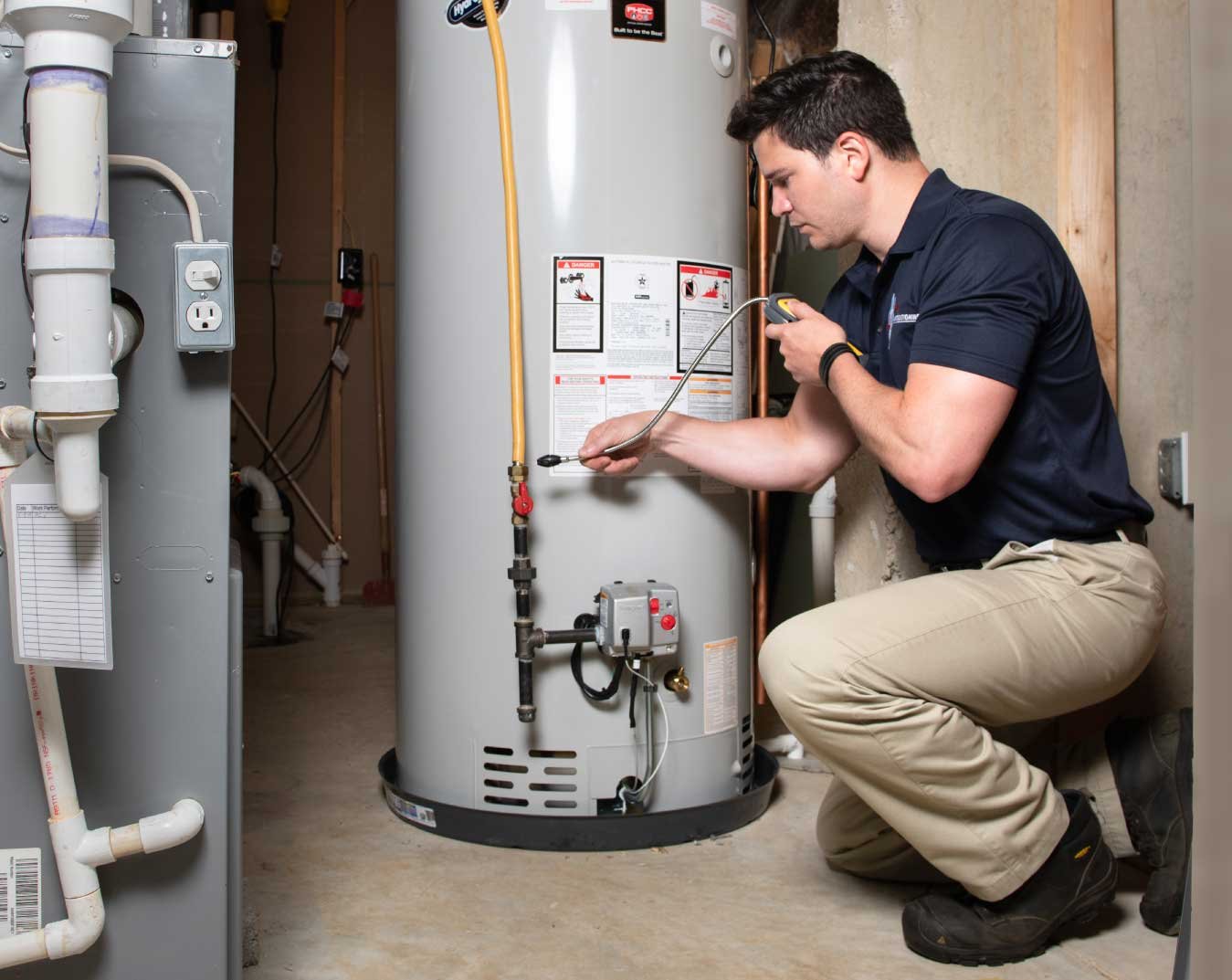 Technician installing a water heater in Doha